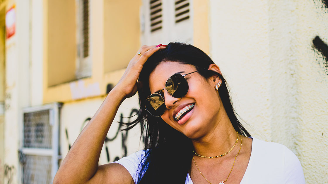Lady with sunglass smiling